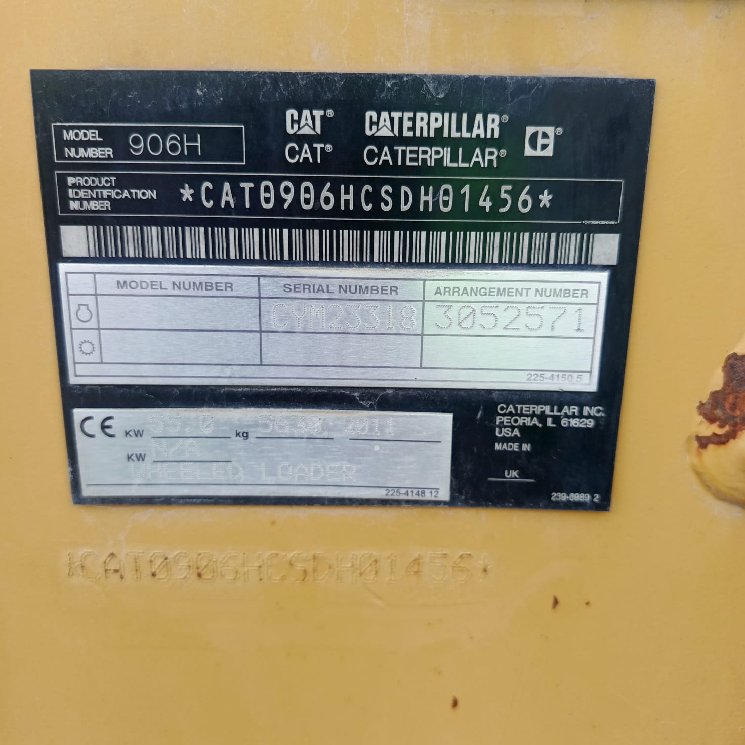 Tabliczka znamionowa maszyny CAT 906H
